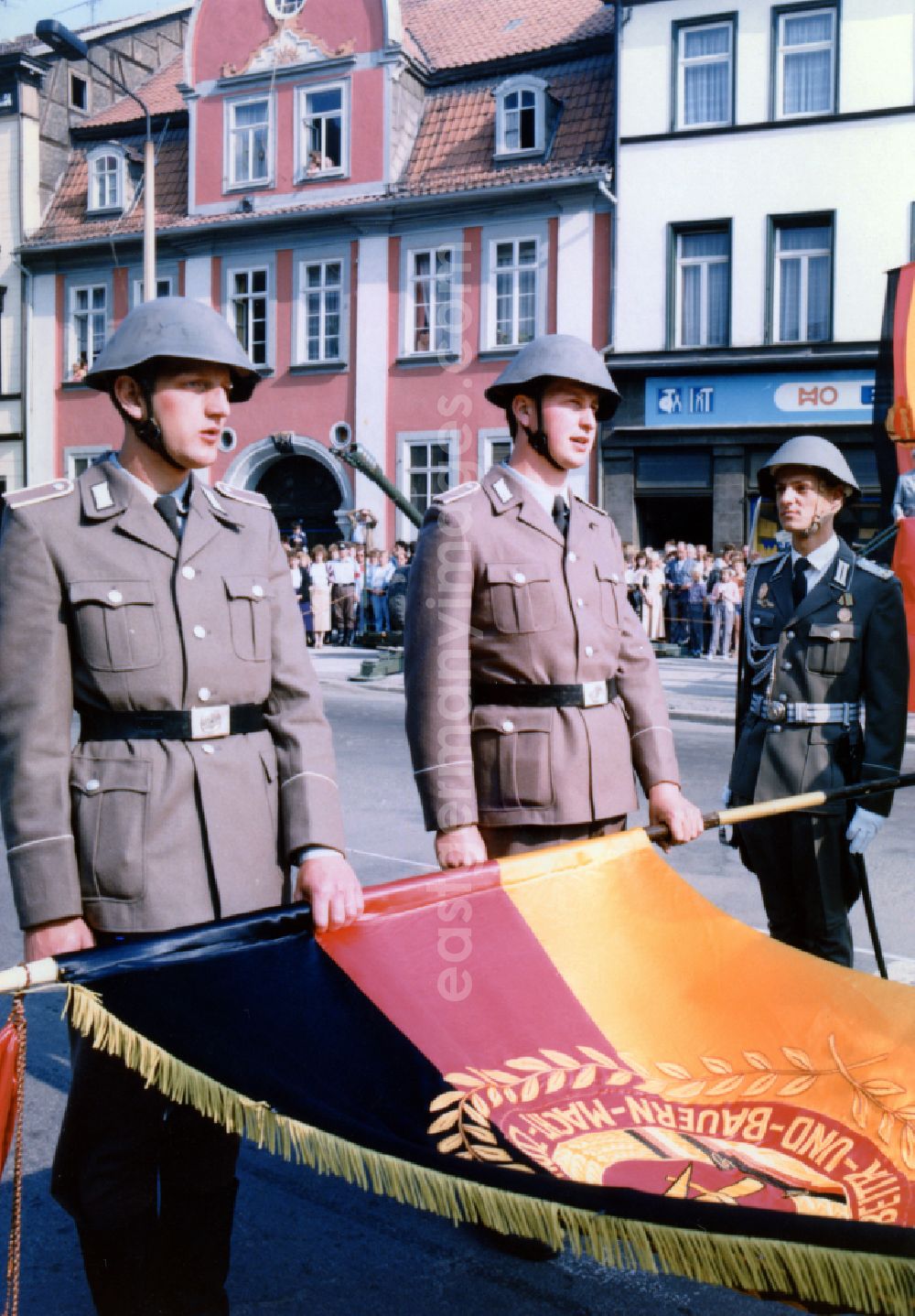 GDR image archive: Mühlhausen - Formation of soldiers and officers on the occasion of the ceremony to take the oath of allegiance to the NVA National People's Army on Wilhelm-Pieck-Platz in Muehlhausen in the state of Thuringia on the territory of the former GDR, German Democratic Republic