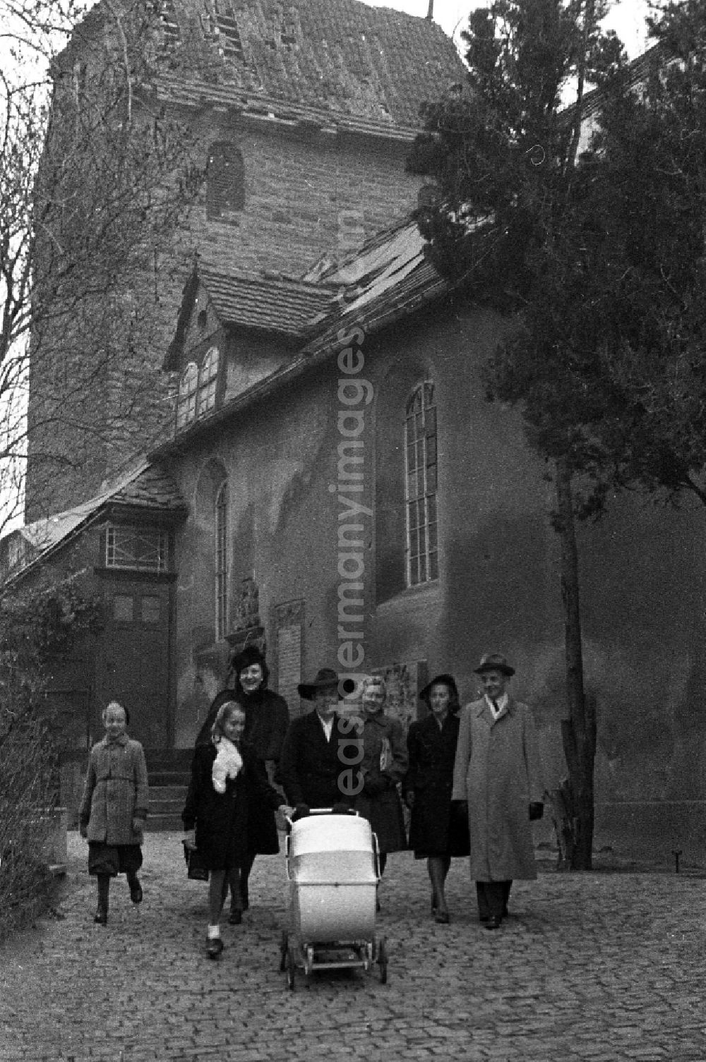 GDR picture archive: Merseburg - Sunday walk of a family by baby carriage in Merseburg in the federal state Saxony-Anhalt in the area of the former GDR, German democratic republic