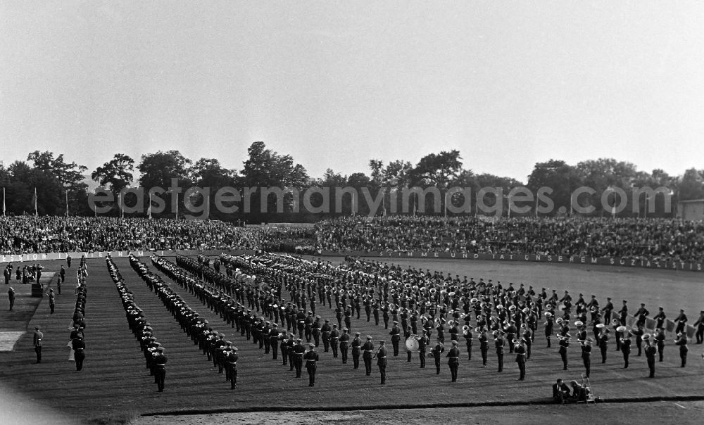 GDR photo archive: Dresden - Soviet soldiers in the uniform of the Red Army of the GSSD Group of Soviet Armed Forces in Germany of a music corps making music on the occasion of the 7th Workers' Festival in the stadium in Dresden in the state of Saxony on the territory of the former GDR, German Democratic Republic