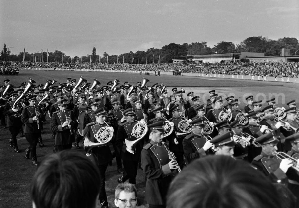 GDR picture archive: Dresden - Soviet soldiers in the uniform of the Red Army of the GSSD Group of Soviet Armed Forces in Germany of a music corps making music on the occasion of the 7th Workers' Festival in the stadium in Dresden in the state of Saxony on the territory of the former GDR, German Democratic Republic