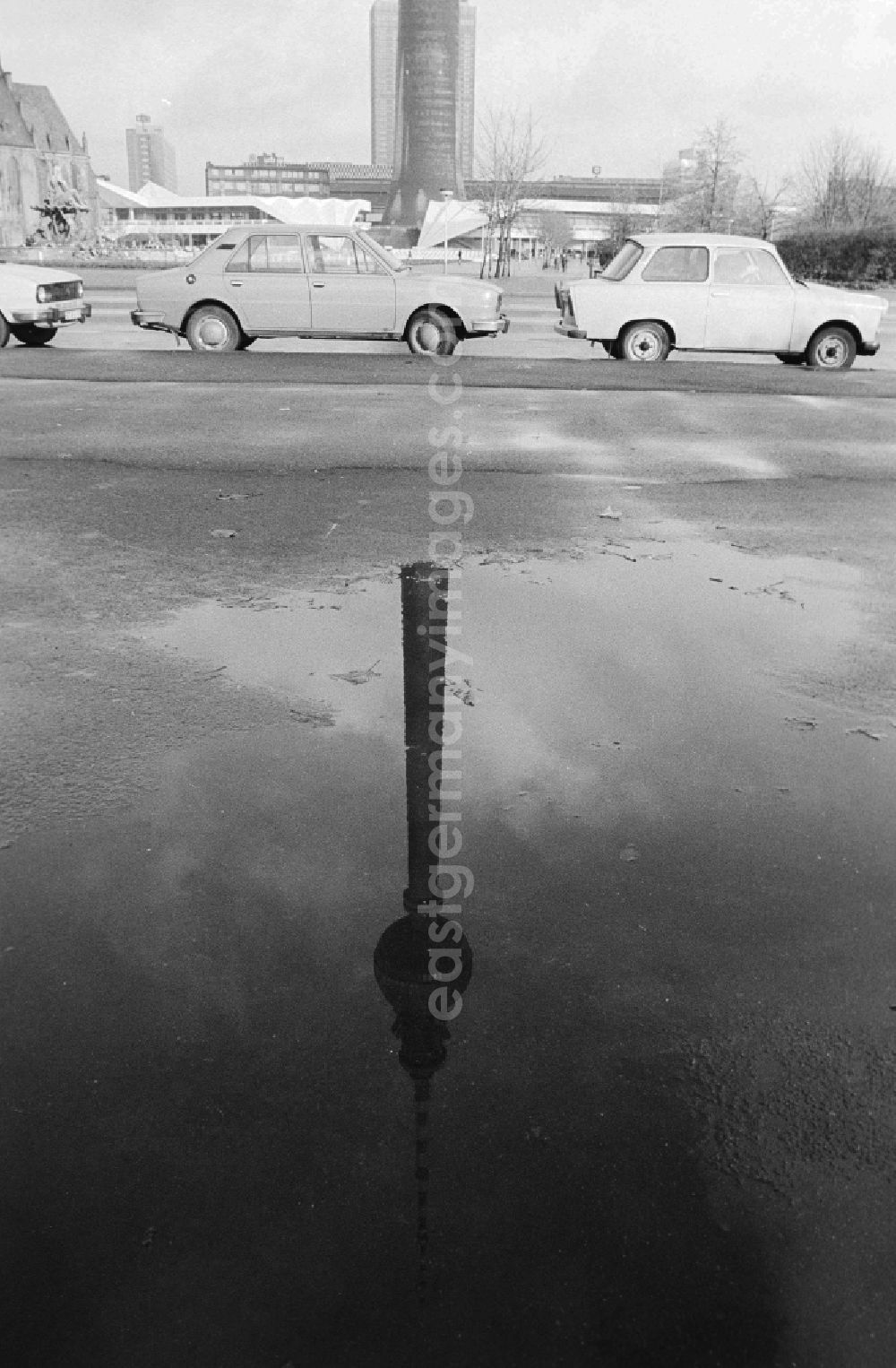 GDR picture archive: Berlin - Reflexion of the Berlin television tower in a puddle in Berlin, the former capital of the GDR, German democratic republic