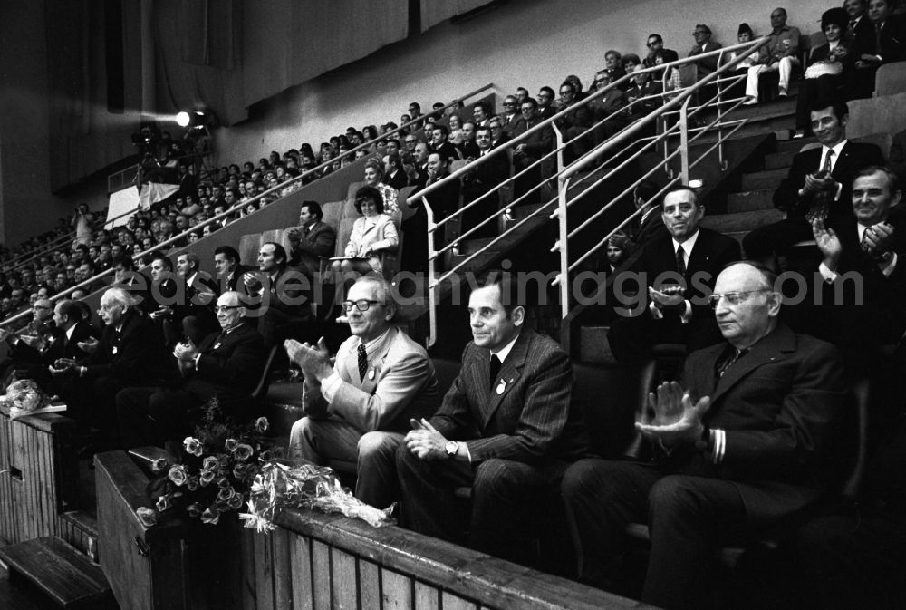 Berlin: Recording of the sports show of the DTSB (German Gymnastics and Sports Federation) in the Dynamo Sports Hall in the Hohenschoenhausen Sports Forum - Erich Honecker (1st row, 3rd from left - head of the sports department until 1971, then First Secretary of the Central Committee of the SED), Manfred Ewald (1st row, 2nd from left - 1961-1988 President of the DTSB) and other party functionaries sit in the audience and applaud in Berlin, the former capital of the GDR, German Democratic Republic