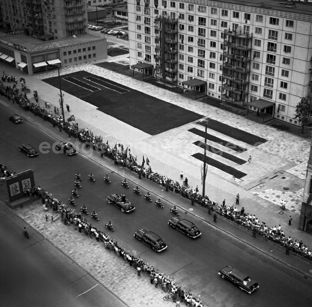 GDR photo archive: Berlin - State visit of the Soviet Prime Minister Nikita Khrushchev to Berlin-Mitte in the territory of the former GDR, German Democratic Republic. Nikita Khrushchev and Walter Ulbricht drive together past spectators along Stalinallee, now Karl-Marx-Allee