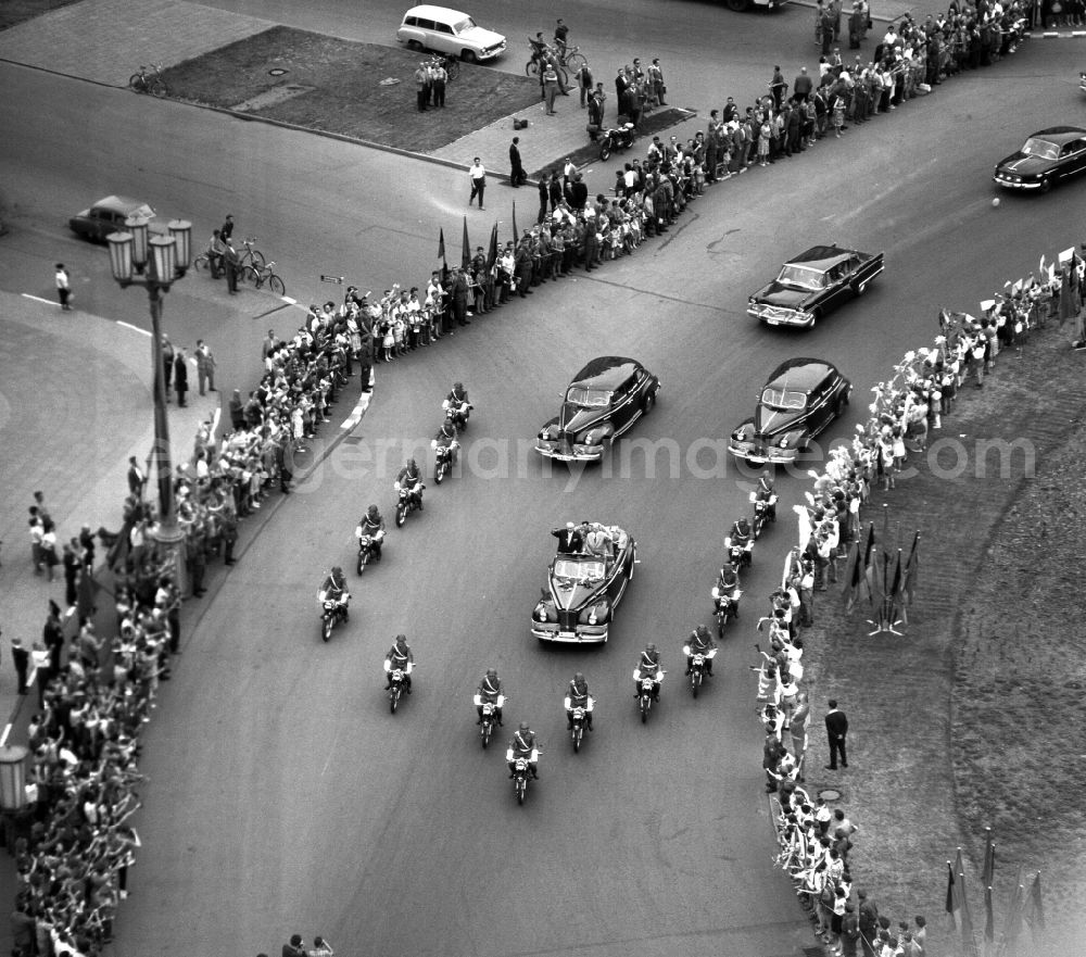 GDR photo archive: Berlin - State visit of the Soviet Prime Minister Nikita Khrushchev to Berlin in the territory of the former GDR, German Democratic Republic. Nikita Khrushchev and Walter Ulbricht drive together past spectators on Strausberger PLatz along Stalinallee, now Karl-Marx-Allee
