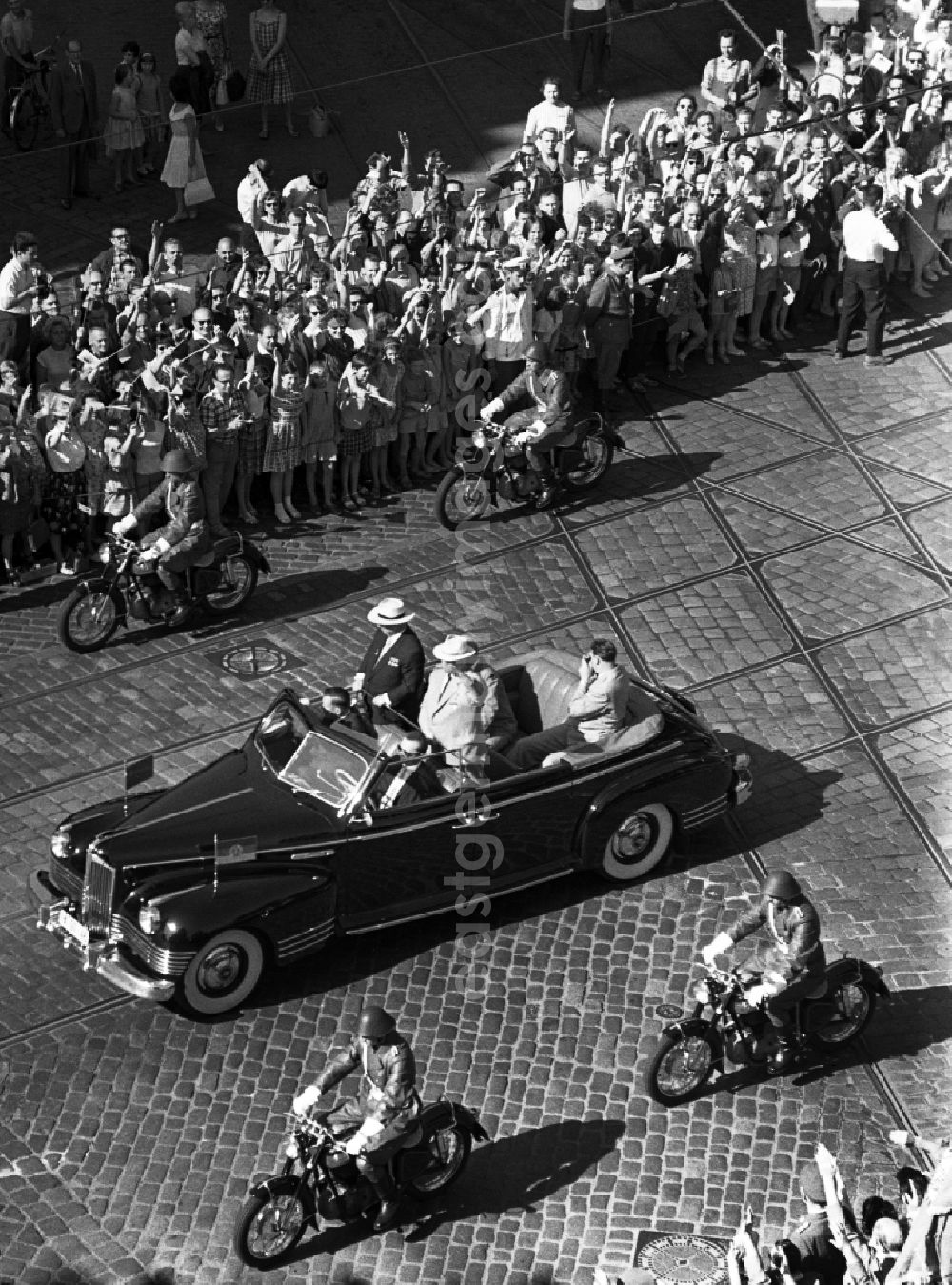 GDR picture archive: Berlin - State visit of the Soviet Prime Minister Nikita Khrushchev to Berlin in the territory of the former GDR, German Democratic Republic. Nikita Khrushchev and Walter Ulbricht drive past spectators together at Alexanderplatz