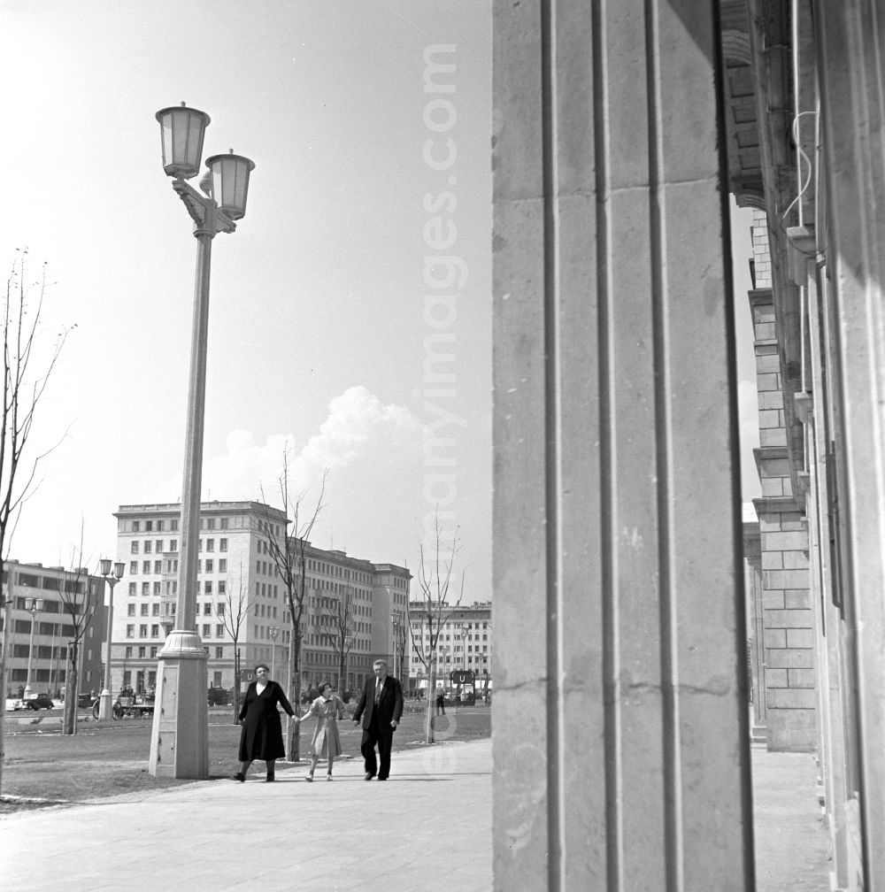 GDR photo archive: Berlin - People strolling in the newly built Stalinallee (now Karl-Marx-Allee) in East Berlin in the district of Friedrichshain on the territory of the former GDR, German Democratic Republic