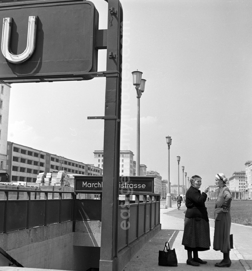 Berlin: View of the newly built Stalinallee (now Karl-Marx-Allee) at the Marchlewskistrasse subway station in East Berlin in the territory of the former GDR, German Democratic Republic. Women in conversation