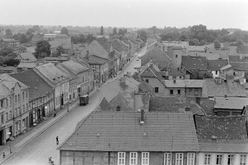 GDR picture archive: Bernau - Roof landscape of the old apartment buildings and traffic situation in the street area on Berliner Strasse in Bernau, Brandenburg in the area of the former GDR, German Democratic Republic