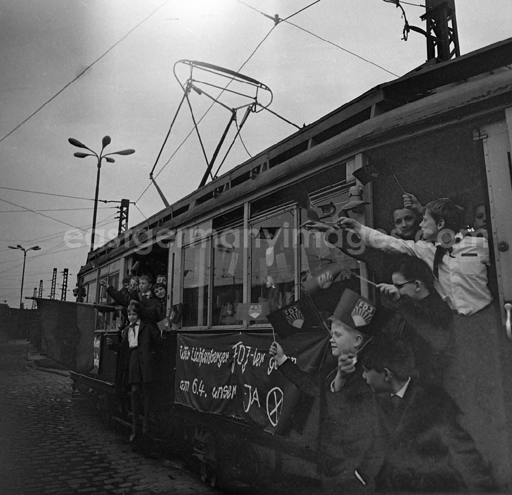 GDR image archive: Berlin - Tram of the TM 36 series with young pioneers and visual advertising for the new GDR constitution in the BVG depot in the district of Pankow on Siegfriedstrasse in the district of Lichtenberg in Berlin East Berlin on the territory of the former GDR, German Democratic Republic