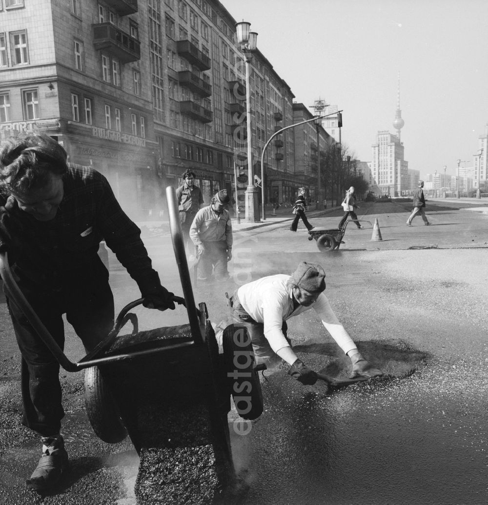 GDR photo archive: Berlin - Roadworks on the Karl-Marx-Allee in Berlin street corner Andreas street