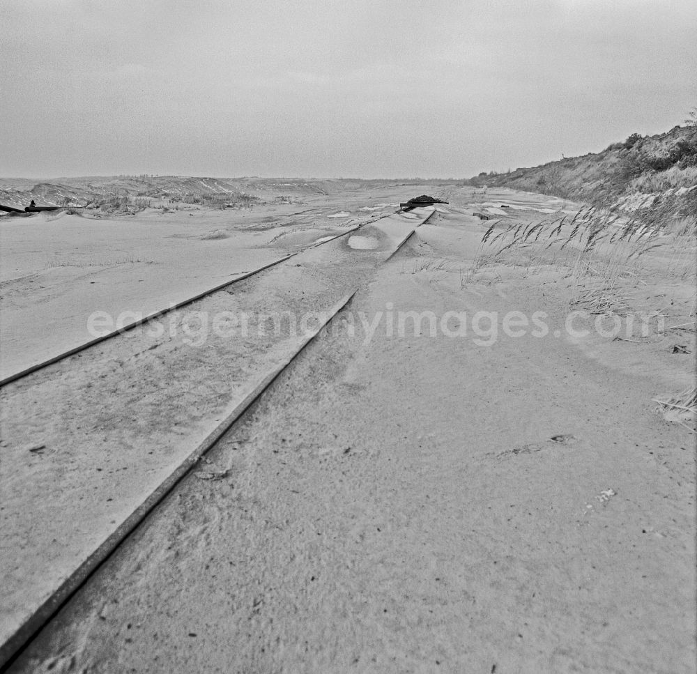 GDR photo archive: Boxberg/Oberlausitz - Site of the opencast mine for mining brown coal with sand-covered transport rails in Boxberg/Oberlausitz, Saxony in the territory of the former GDR, German Democratic Republic