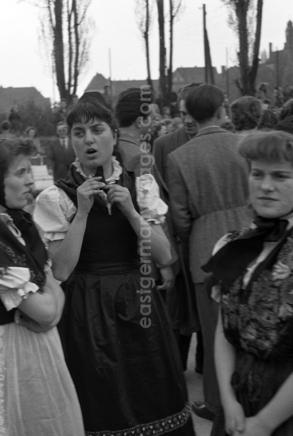 GDR photo archive: Halberstadt - Members of a dance group of the folklore ensemble on a square on Harmoniestrasse in Halberstadt in the state Saxony-Anhalt on the territory of the former GDR, German Democratic Republic