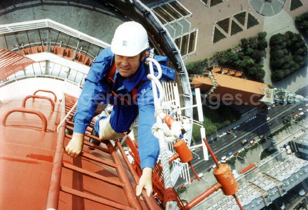 Berlin: Technicians during maintenance and repair work during external work on the antenna support of the Berlin TV tower in the Mitte district of Berlin East Berlin