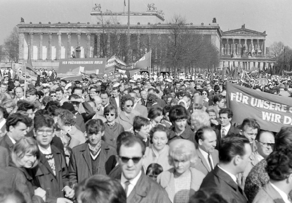 GDR photo archive: Berlin - Participants der Demonstration zum 1. Mai on the streets of the city center on place Schlossplatz on place Schlossplatz ( Marx-Engels-Platz ) in Berlin Eastberlin on the territory of the former GDR, German Democratic Republic