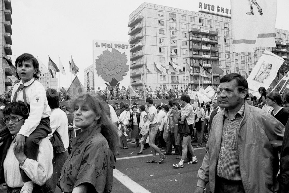 GDR photo archive: Berlin - Participants of the May 1st demonstration on Karl-Marx-Allee (Stalinallee) in the city center in the Mitte district of Berlin East Berlin in the territory of the former GDR, German Democratic Republic