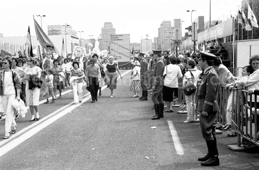 GDR picture archive: Berlin - Participants of the May 1st demonstration on Karl-Marx-Allee (Stalinallee) in the city center in the Mitte district of Berlin East Berlin in the territory of the former GDR, German Democratic Republic