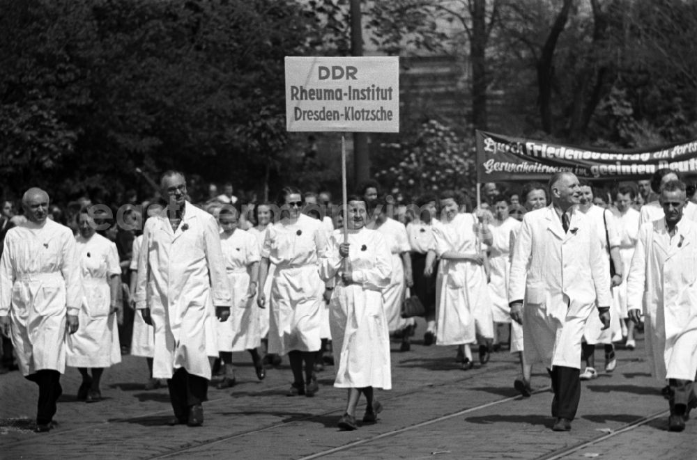 GDR picture archive: Dresden - Medics, nurses and doctors from the Rheumatism Institute in white coats as participants in the May Day demonstration on the streets of the city center in the Altstadt district in Dresden, Saxony on the territory of the former GDR, German Democratic Republic