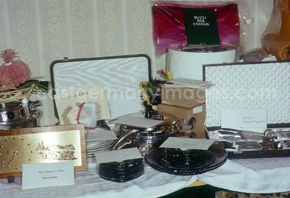 GDR image archive: Neustrelitz - Table with classical presents to a wedding in Neustrelitz in the federal state Mecklenburg-West Pomerania in the area of the former GDR, German democratic republic