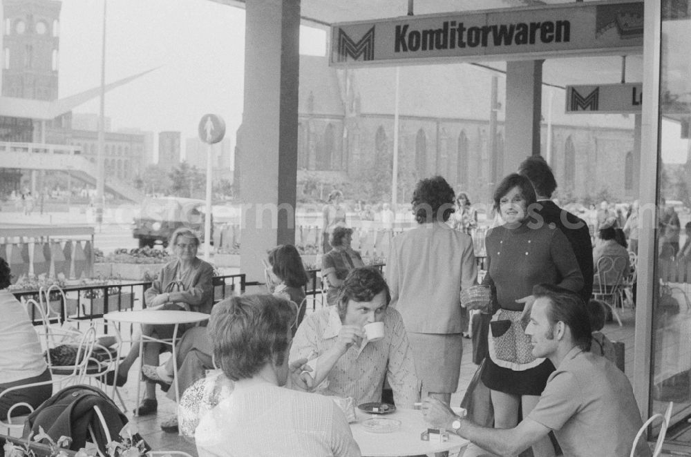 Berlin: Tourists at a cafe at the Karl-Liebknecht-street in Berlin, the former capital of the GDR, the German Democratic Republic