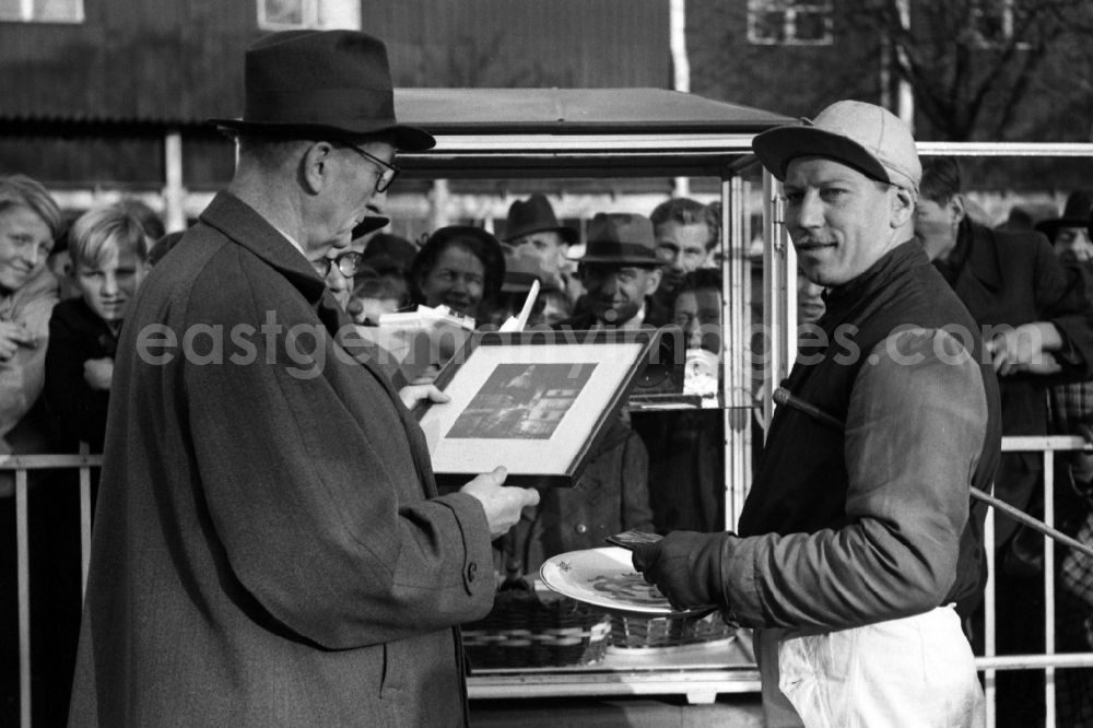 GDR image archive: Dresden - Trotting driver Gerhard Krueger receives an honorary prize at the Dresden-Seidnitz racecourse after his victory in Dresden in the state Saxony on the territory of the former GDR, German Democratic Republic