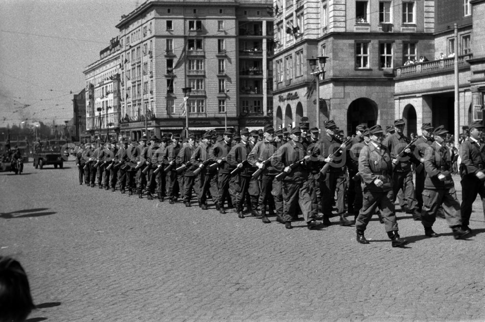 GDR picture archive: Magdeburg - Uniformed units of the combat groups of the working class in the parade in Magdeburg in Saxony-Anhalt. Here at the parade on 1 May. The battle groups of the working class struggle groups were a paramilitary organization of workers in companies in the GDR. The armament of the combat groups consisted among other things of machine guns of the type PPSh-41
