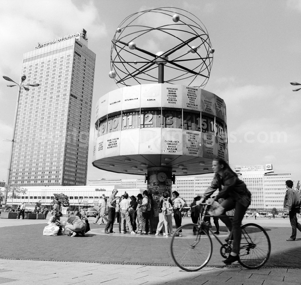 Berlin: The Urania World Clock at Alexanderplatz in Berlin, the former capital of the GDR, German Democratic Republic. In the background the Hotel Stadt Berlin