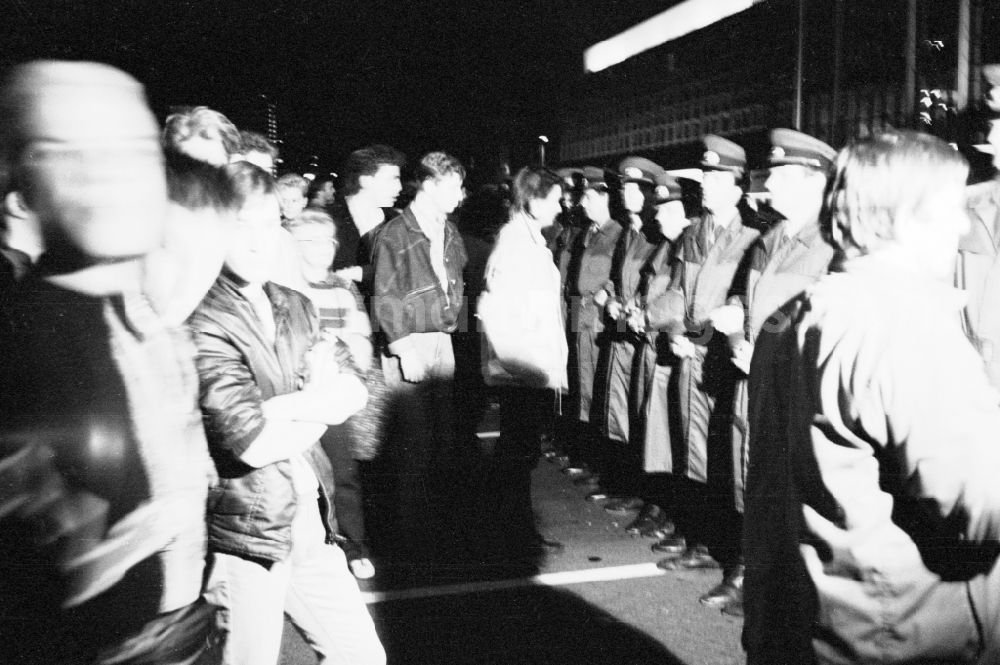 Berlin: Demonstration and street protest action by opposition citizens is prevented from continuing their march on Karl-Liebknecht-Strasse by a police cordon of the Peoples Police - on the eve of the founding holiday in the Mitte district of Berlin East Berlin in the area of the former GDR, German Democratic Republic