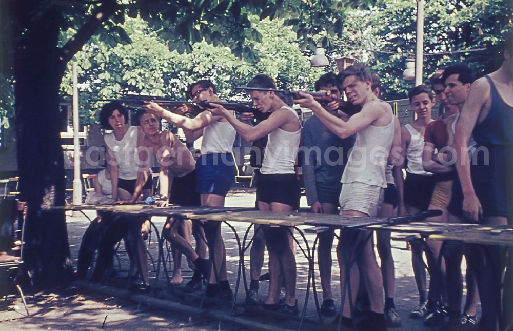 GDR image archive: Berlin - Practical training with a pre-military character in preparation for military service in air rifle shooting on the sports field at Koepenicker Landstrasse 186 in Berlin East Berlin on the territory of the former GDR, German Democratic Republic