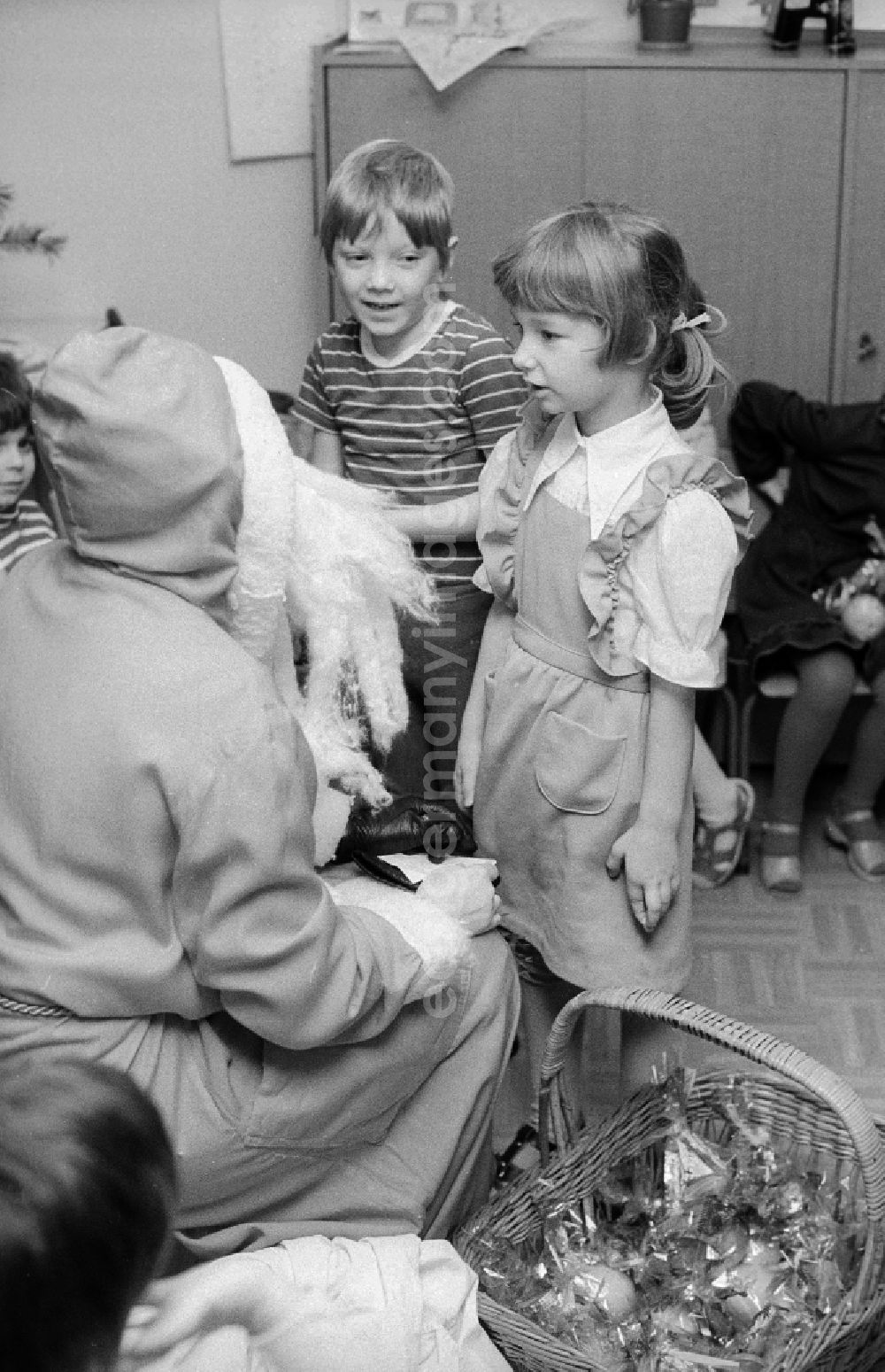 GDR image archive: Berlin - The Santa Claus gives children with presents in a kindergarten in Berlin, the former capital of the GDR, German democratic republic