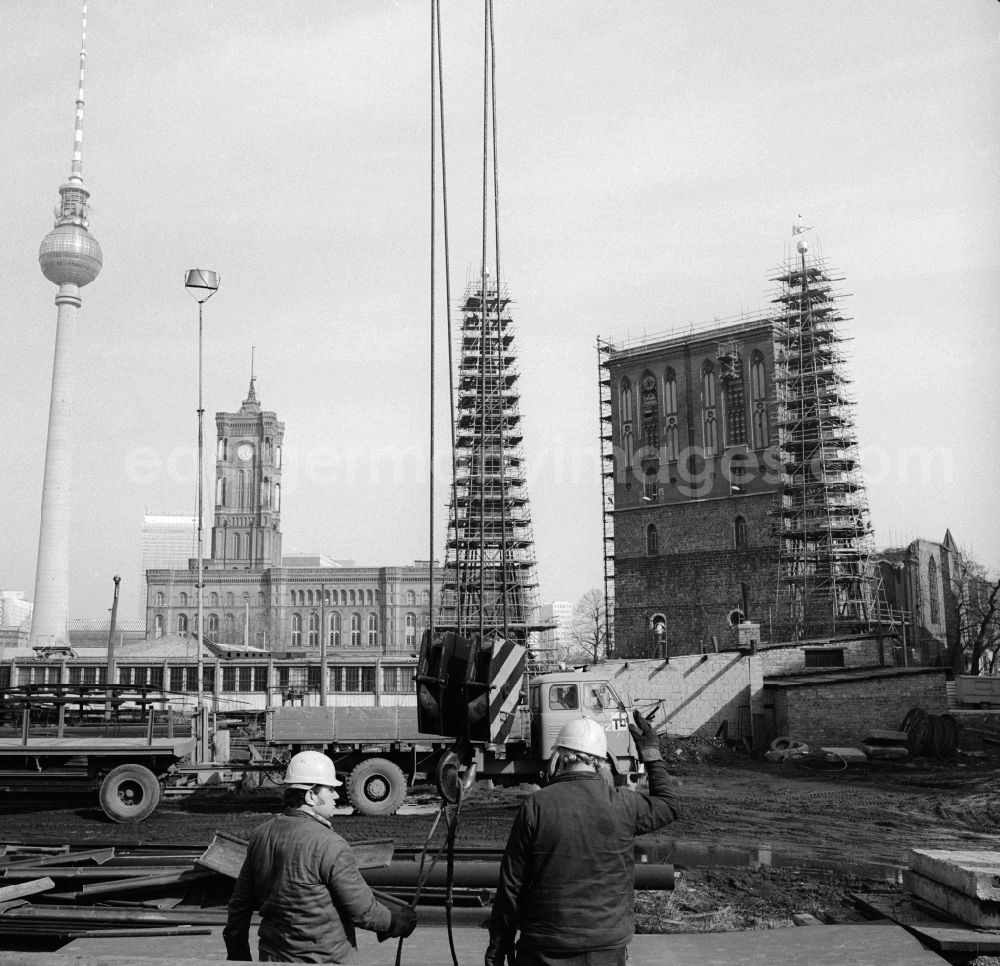GDR picture archive: Berlin - Reconstruction / restoration of the Nikolai Church in Berlin, the former capital of the GDR, the German Democratic Republic. In the background of the Berlin TV Tower and the Red Town Hall