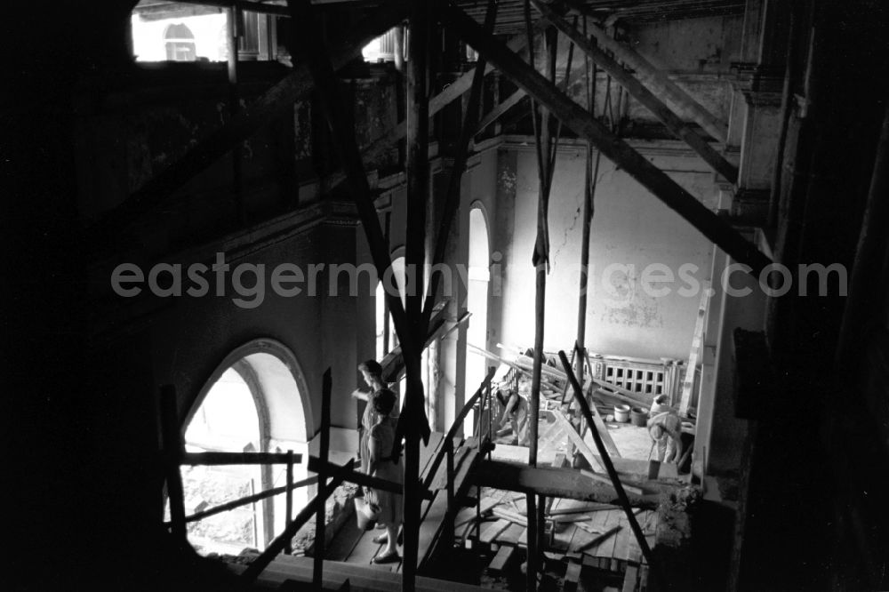 GDR image archive: Dresden - Construction site for the reconstruction of the war-damaged ruins of the Dresden Zwinger on Theaterplatz - Sophienstrasse in the Altstadt district of Dresden in the state of Saxony on the territory of the former GDR, German Democratic Republic