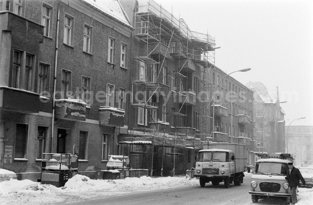 GDR photo archive: Berlin - Winter and snow in the street Siemensstrasse in the district of Treptow-Koepenick in Berlin, the former capital of the GDR, German Democratic Republic. Truck Robur LO 3000 and van Barkas B 100