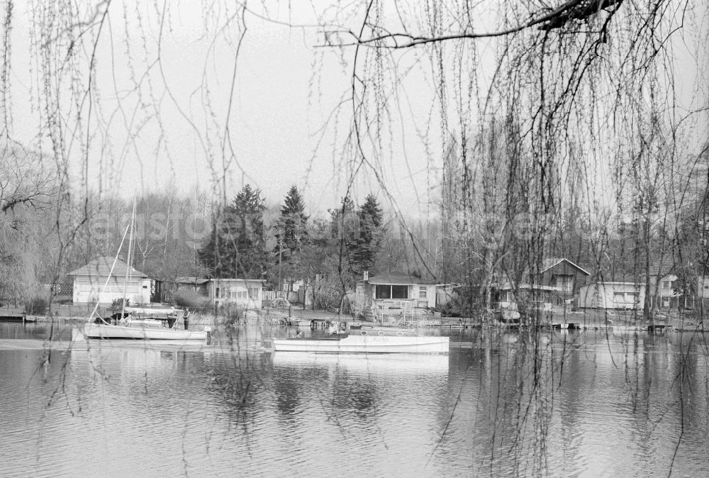 GDR photo archive: Berlin - Weekend properties in the water in New Venedig in a side arm of the Mueggelspree in Berlin, the former capital of the GDR, German democratic republic