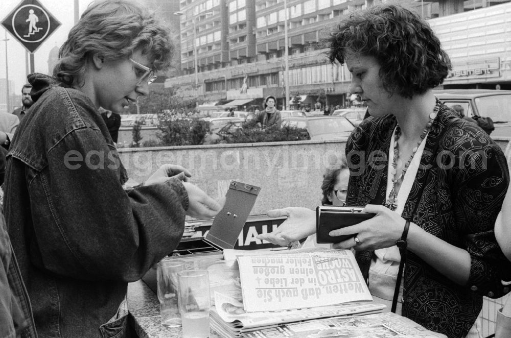 GDR picture archive: Berlin - A newspaper seller sells Western newspapers at an output of a pedestrian underpass at a client, in Berlin, the former capital of the GDR, the German Democratic Republic