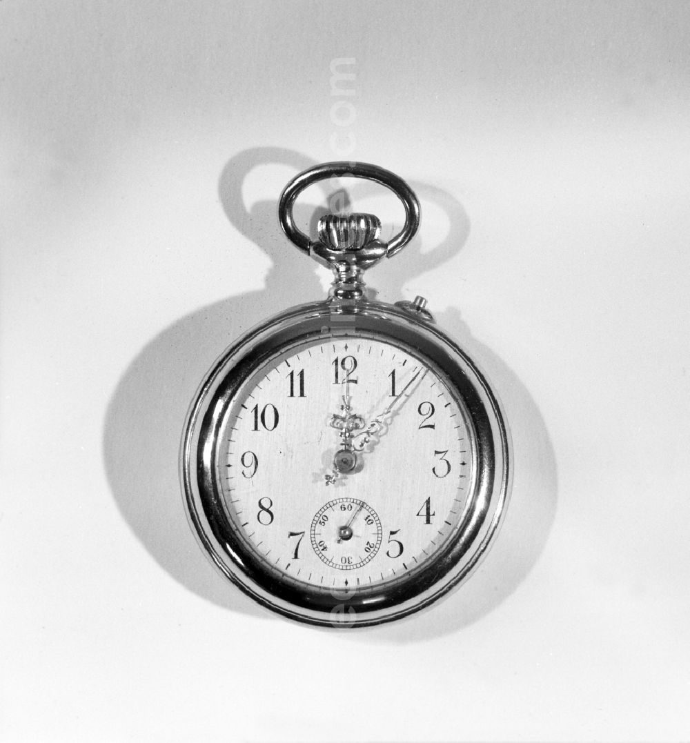 Ruhla: Hours and minutes on a watch facee pocket watch of VEB Uhrenwerke Ruhla in Ruhla in the state Thuringia on the territory of the former GDR, German Democratic Republic
