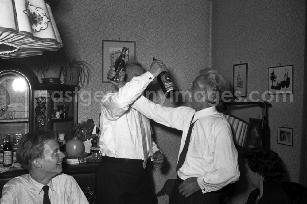 Bad Lauchstädt: Two older men drink brotherhood at a family celebration in bath Lauchstaedt in the federal state Saxony-Anhalt to the area of the former GDR, German democratic republic