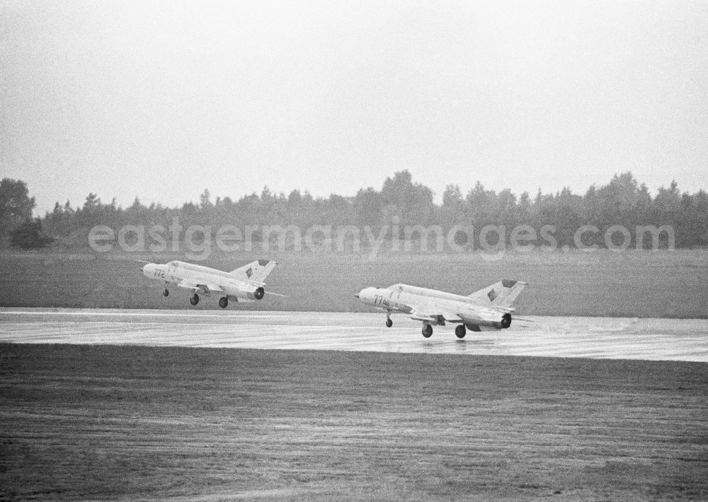 GDR picture archive: Peenemünde - Two MiG-21 fighter squadron of 9 at the start in Peenemuende in Mecklenburg-Western Pomerania in the field of the former GDR, German Democratic Republic