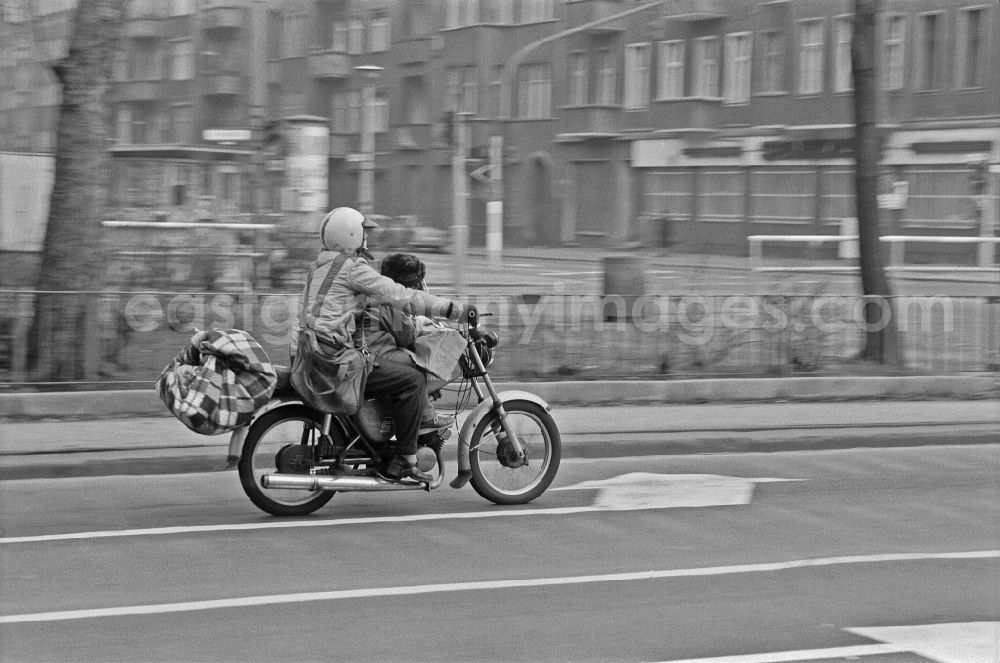 GDR image archive: Berlin - Motorcycle - motor vehicle in road traffic on street Warschauer Strasse in the district Friedrichshain in Berlin Eastberlin on the territory of the former GDR, German Democratic Republic