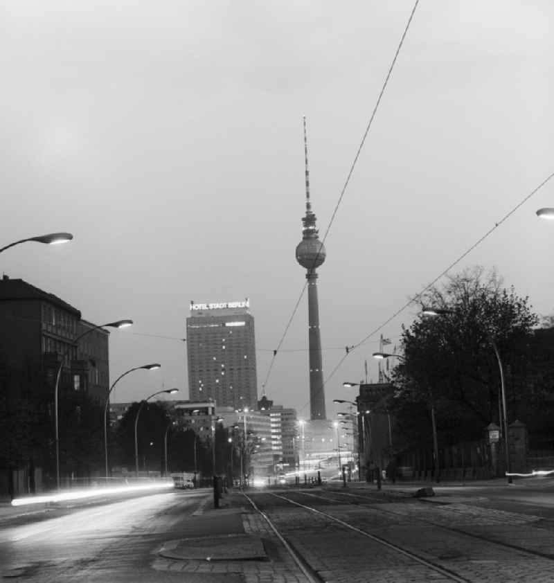 View along the Karl-Liebknecht-Strasse towards Alexanderplatz with the TV tower and the Hotel Stadt Berlin, at night, in Berlin - Mitte