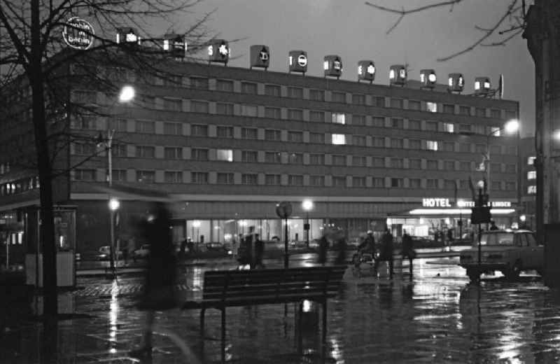 Gastronomic establishment of the INTERHOTEL - Hotel - building 'Unter den Linden' on Friedrichstrasse at night in Berlin East Berlin on the territory of the former GDR, German Democratic Republic