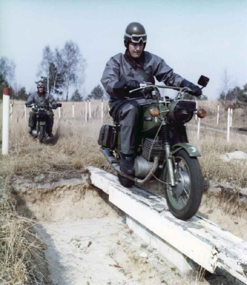 Motorized border guards on MZ motorcycles during a patrol ride near Abbenrode in Harz in today's federal state of Saxony-Anhalt