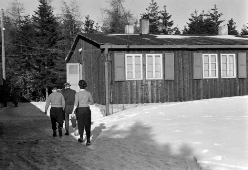 Summer camp operation with pupils and teenagers - covered in snow in winter in Altenberg, Saxony on the territory of the former GDR, German Democratic Republic