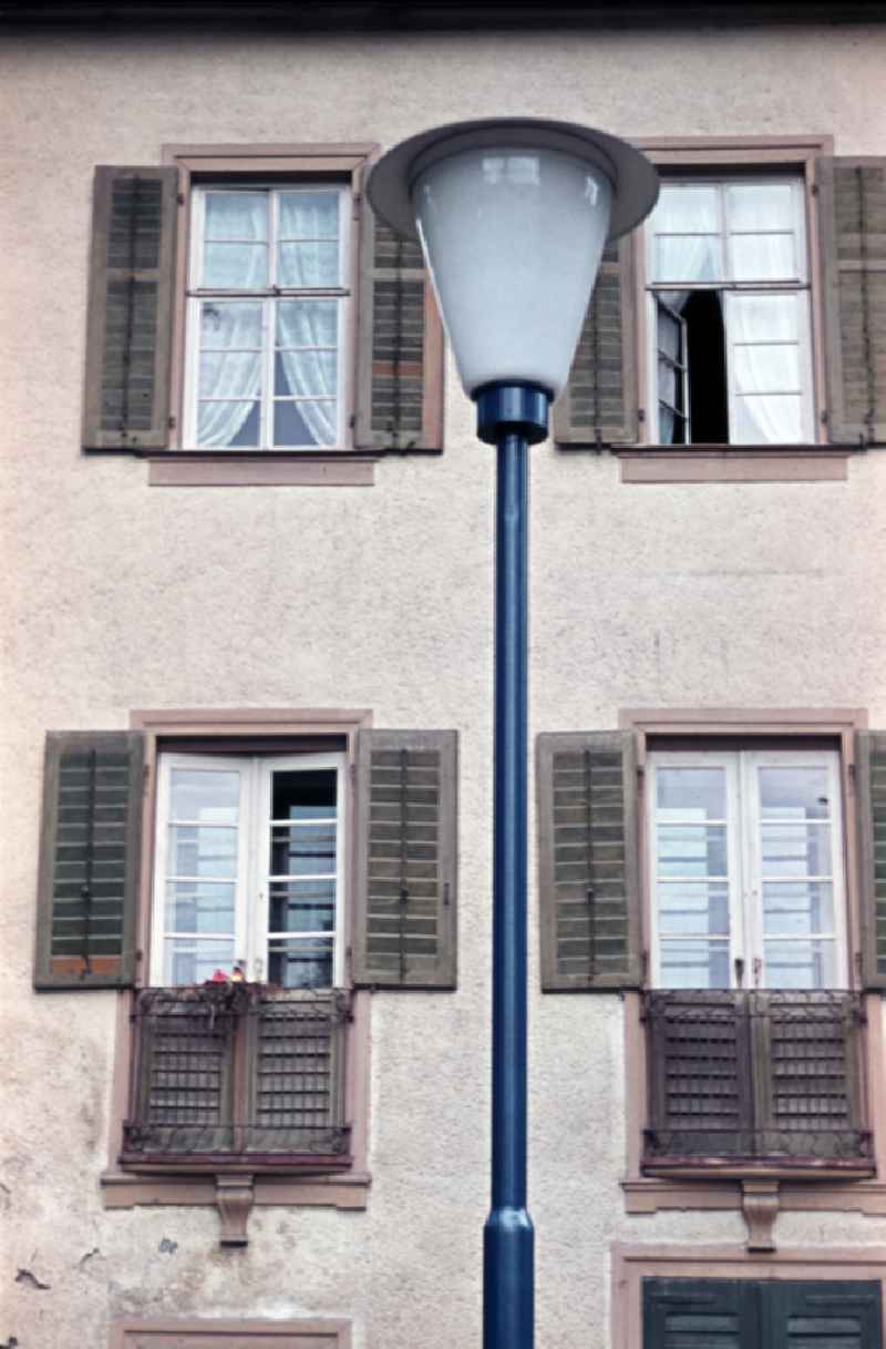 House facade with windows and street lamp in Bad Lobenstein, Thuringia in the area of the former GDR, German Democratic Republic