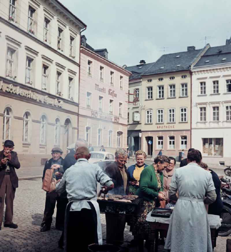 Sale of grilled sausages at the market in Bad Lobenstein, Thuringia in the territory of the former GDR, German Democratic Republic