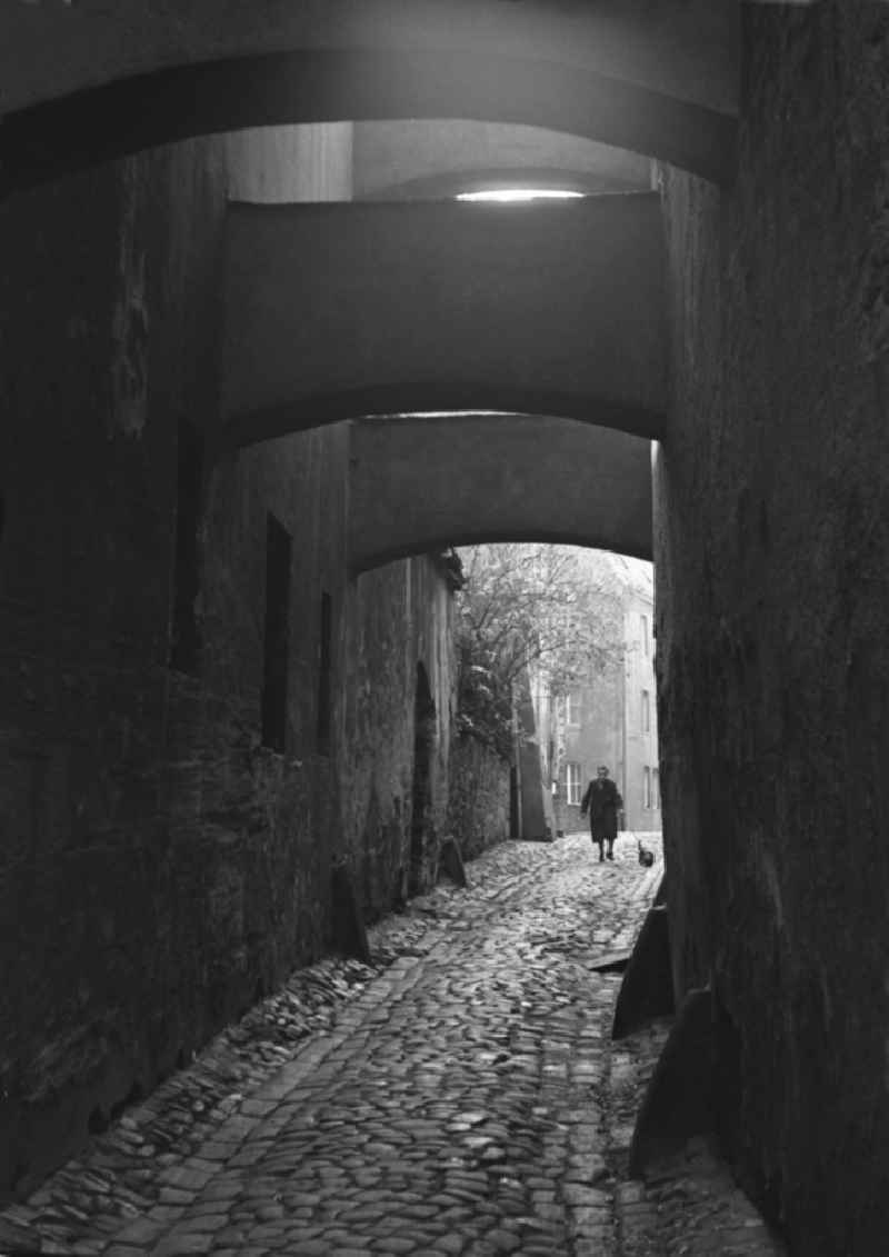 Pedestrians and passers-by in traffic in an alley in the old town in Bautzen, Saxony in the territory of the former GDR, German Democratic Republic