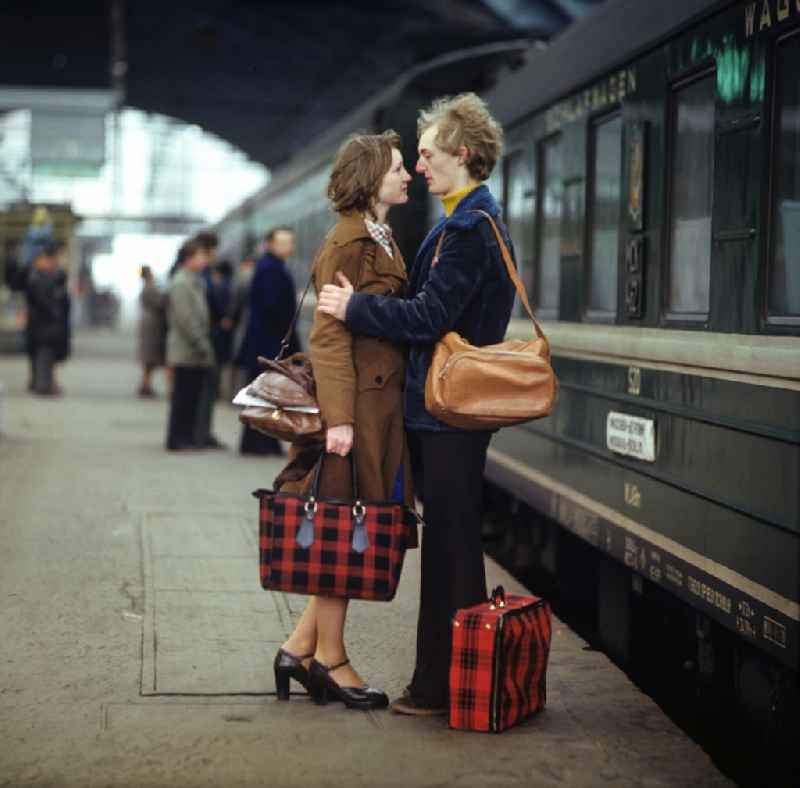 Young couple on a platform at a train at Ostbahnhof in Berlin