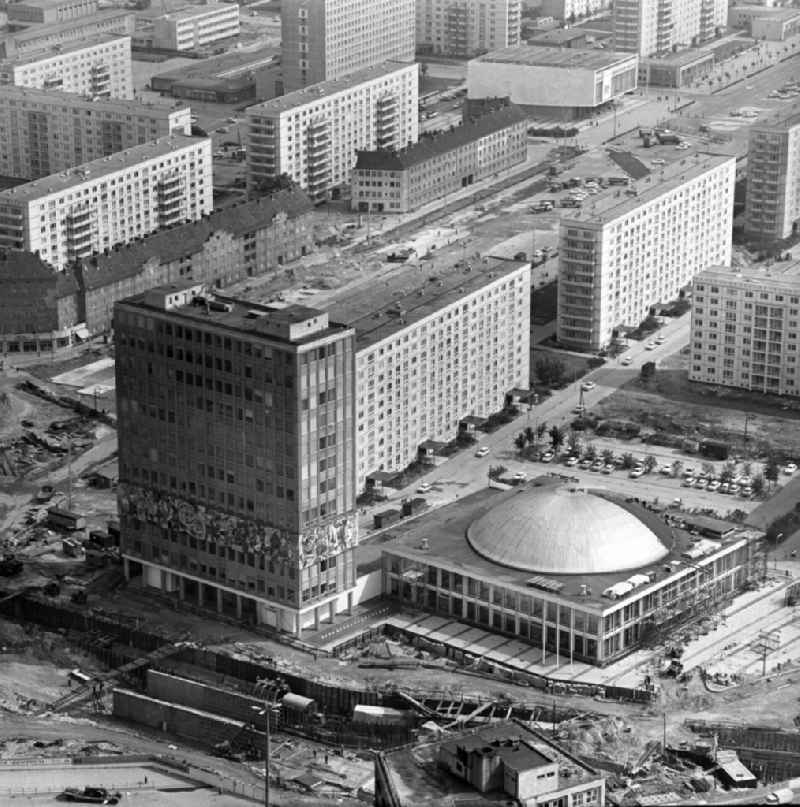 Construction site of the TV tower, the public square Alexanderplatz, the building 'Haus des Lehrers' and the congress hall in Berlin-Mitte