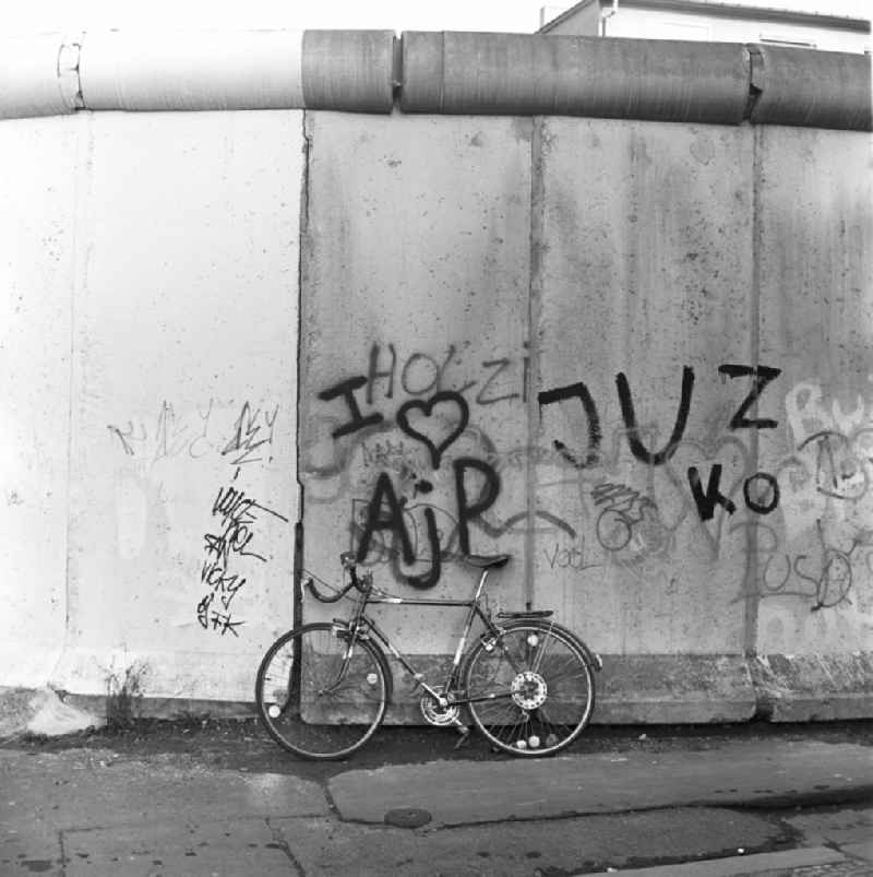 Bicycle leaning against the wall on the West Berlin side of the border checkpoint Heinrich-Heine-Straße shortly after the Wall came down