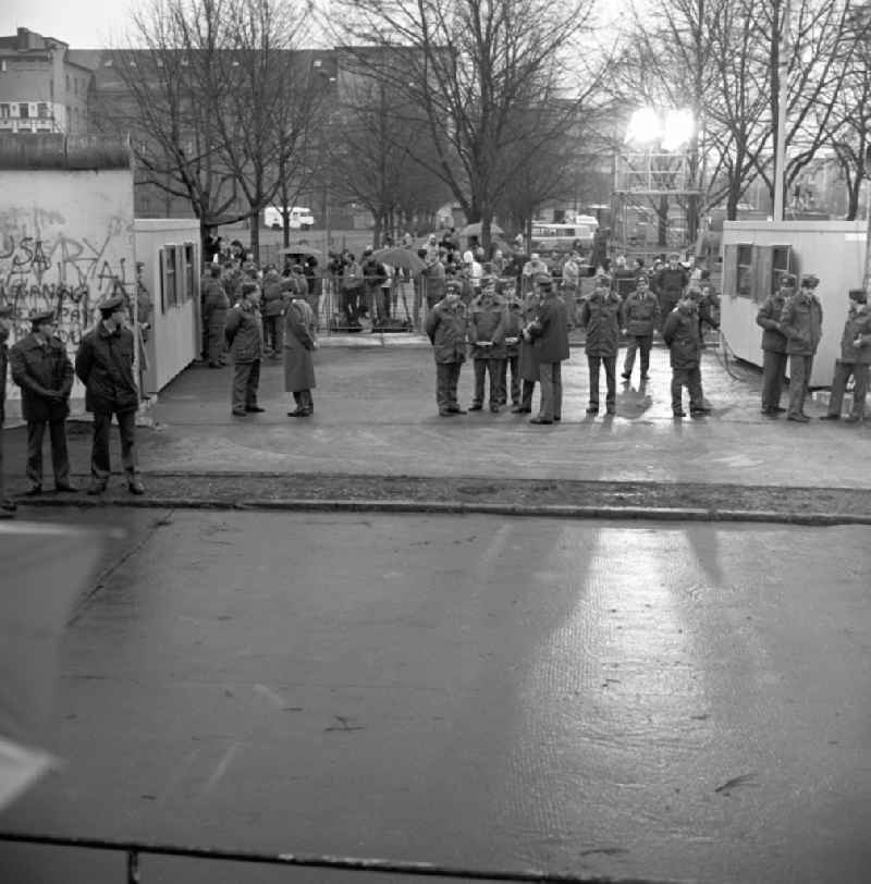 Happening around the Brandenburg Gate shortly before the opening on the occasion of the Berlin Wall in November 1989 in Berlin. Barriers on the 17th of June Street, Strasse des 17. Juni and West German FRG and East German GDR border police