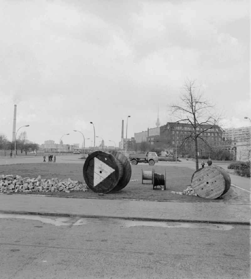 Cable drums and bricks stored on a meadow in Berlin - Friedrichshain